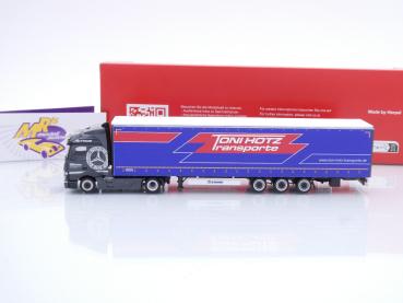 Preview: Herpa 317573 # Mercedes-Benz Actros Lowliner-Sattelzug " Toni Hotz Transporte " 1:87
