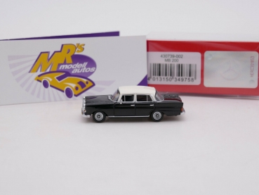 Preview: Herpa 430739-002 # Mercedes Benz 200 Heckflosse " schwarz-weiß " 1:87