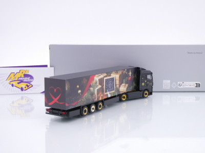 Preview: Herpa 319973 # MAN eTGX GM Koffer-Sattelzug " Weihnachtsmodell 2025 " 1:87