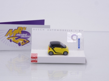 Preview: Busch 46224 # Smart Fortwo Electric Drive mit Ladesäule Baujahr 2012 " gelb-schwarz " 1:87