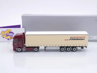 Preview: Herpa 962216 # MAN TGX GX Gardinenplanen-Sattelzug " Schönholzer Trans " 1:87